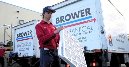 technician holding filters