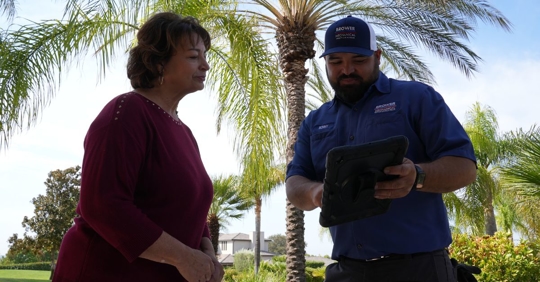 HVAC tech explaining options to customer