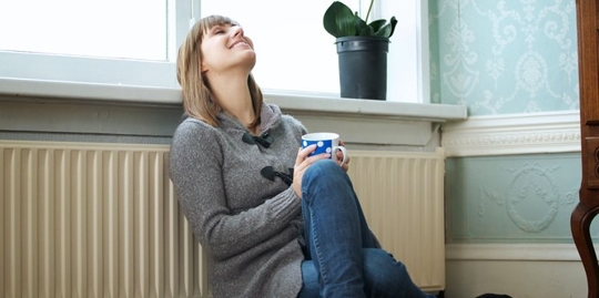a woman having a relaxing mug of drink