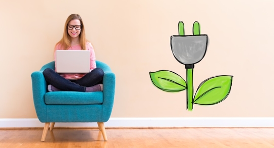 woman on a couch with a laptop
