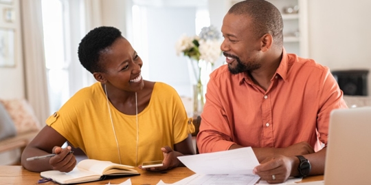 couple holding utility bills