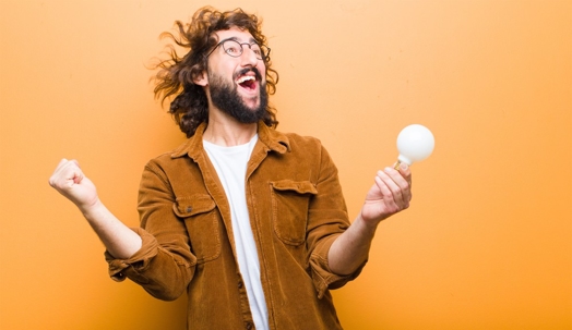 happy man holding a bulb