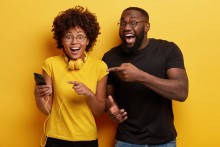 man and woman excited about podcast