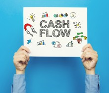 Person holding a cash flow sign | Cash Flow Home Energy