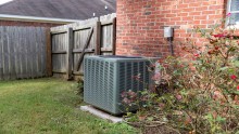 central air conditioning unit outside home