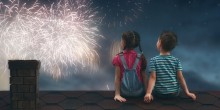 kids watching fireworks on top of home