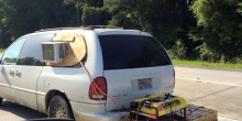 generator and window ac unit on minivan