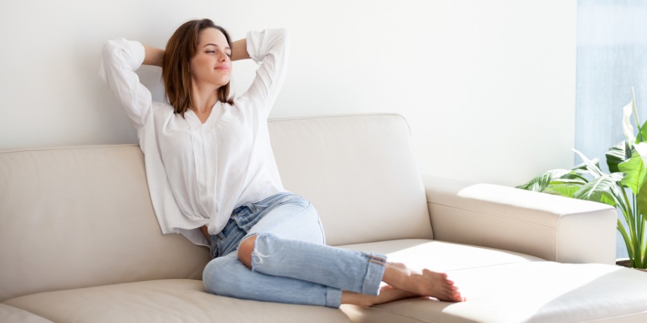 woman relaxing comfortably at home, clean healthy home